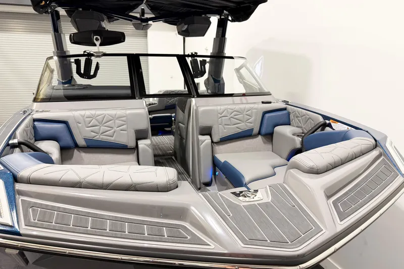 Slide: The Image of 2022 Nautique Super Air Nautique G23 Paragon interior with luxurious gray and blue seating. - 5
