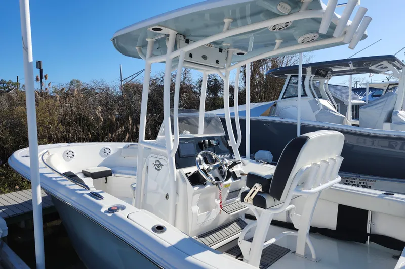 Slide: The Image of 2022 Tidewater 220 LXF boat with T-top and modern helm station. - 4