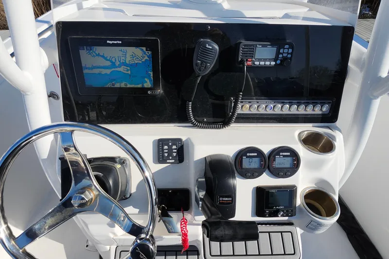 Slide: The Image of 2022 Tidewater 220 LXF boat dashboard with navigation and control instruments. - 6