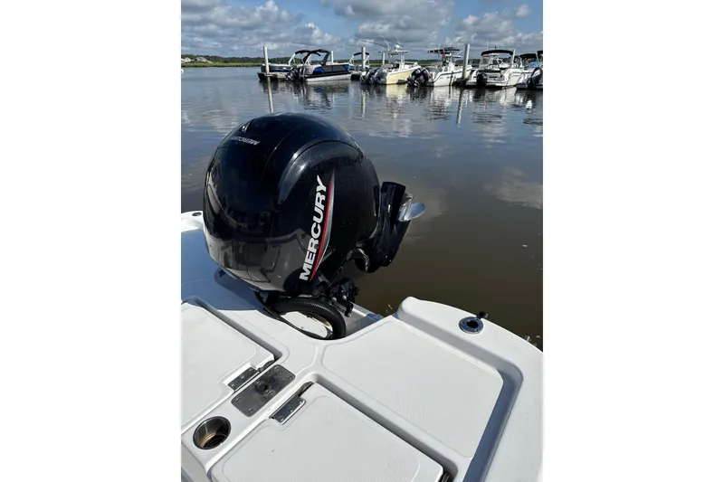 Slide: The Image of 2025 NauticStar 214 Shallow Bay with Mercury engine, docked on a sunny day. - 6