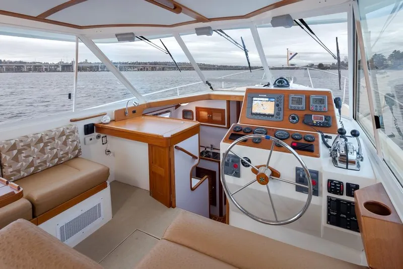 Slide: The Image of Interior of 2007 Bruckmann BLUESTAR boat with steering wheel and navigation equipment. - 13