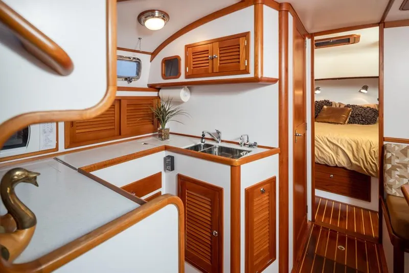 Slide: The Image of Luxurious 2007 Bruckmann BLUESTAR yacht interior with wood accents and cozy bedroom. - 16
