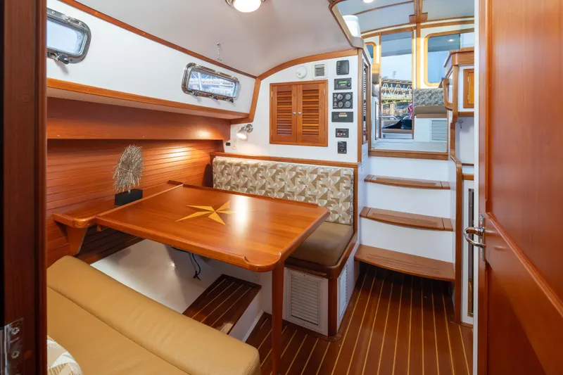 Slide: The Image of Luxurious 2007 Bruckmann BLUESTAR yacht interior with wooden dining area and elegant seating. - 19