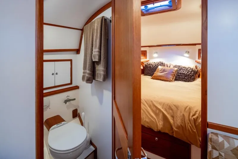 Slide: The Image of Interior of 2007 Bruckmann BLUESTAR yacht with cozy bedroom and compact bathroom. - 20