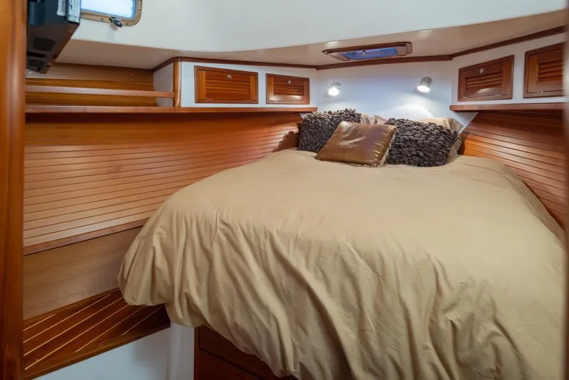 Slide: The Image of Luxurious cabin interior of 2007 Bruckmann BLUESTAR yacht with cozy bedding and wooden accents. - 22