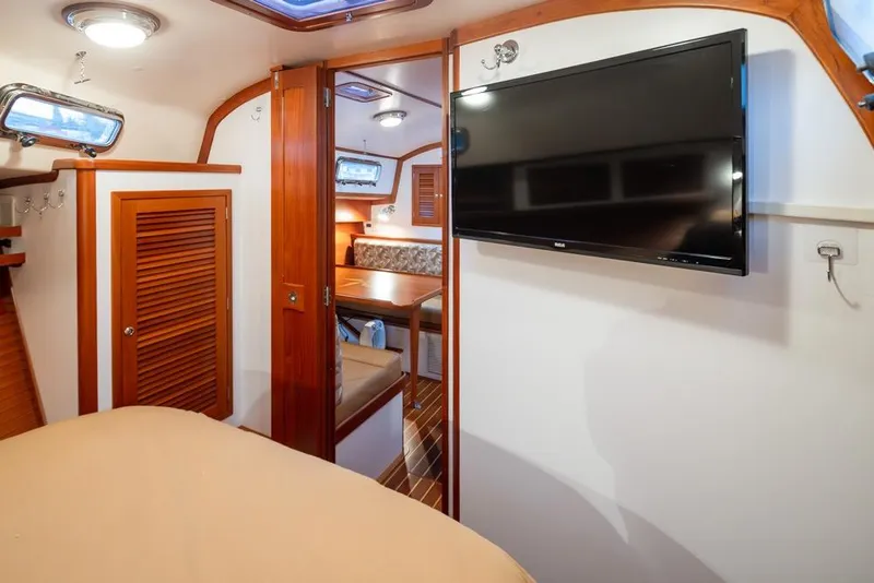 Slide: The Image of Interior of 2007 Bruckmann BLUESTAR yacht with wood accents and mounted TV. - 23