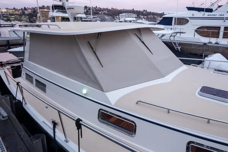 Slide: The Image of 2007 Bruckmann BLUESTAR boat docked at marina during sunset. - 7