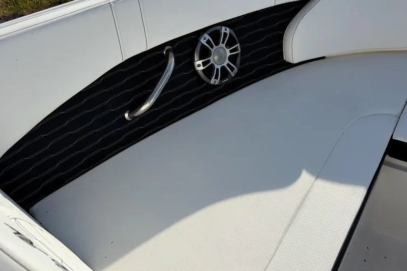 Slide: The Image of 2024 Sea Ray SPX 230 boat interior with white seating and speaker detail. - 4