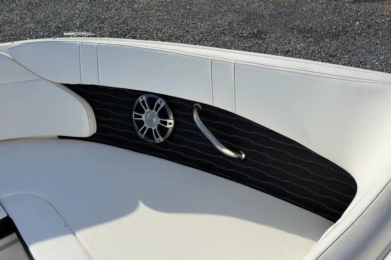 Slide: The Image of 2024 Sea Ray SPX 230 boat interior with white seating and speaker detail. - 5