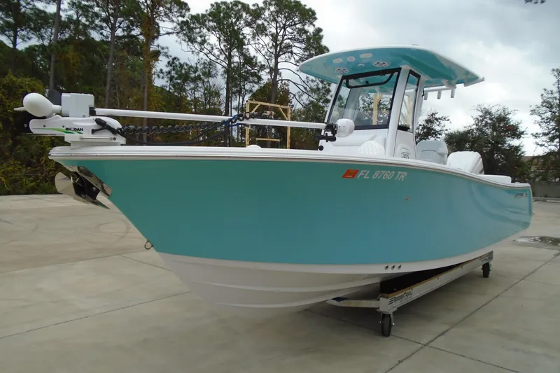 The Image of 2024 Sportsman Heritage 231 Center Console boat in light blue, parked outdoors. - 0