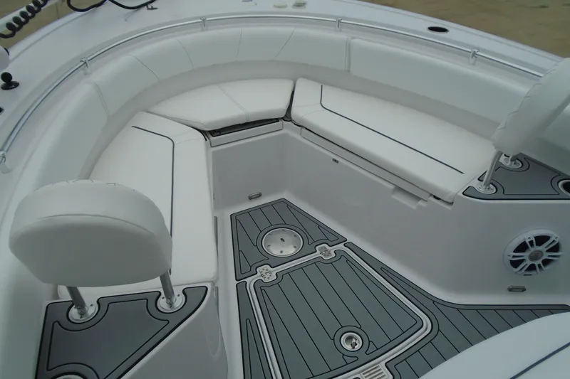 Slide: The Image of 2024 Sportsman Heritage 231 Center Console boat interior with cushioned seating and sleek design. - 17