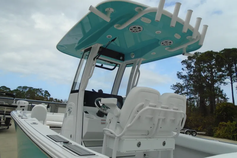 Slide: The Image of 2024 Sportsman Heritage 231 Center Console boat with T-top and dual seating. - 26