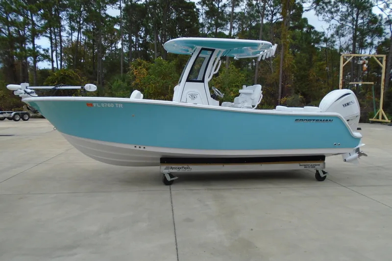 Slide: The Image of 2024 Sportsman Heritage 231 Center Console boat in light blue, parked outdoors. - 29