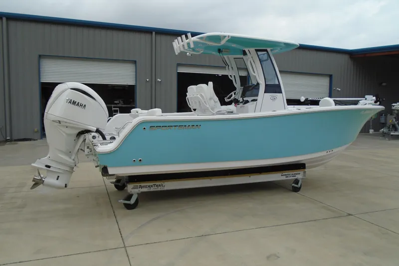 Slide: The Image of 2024 Sportsman Heritage 231 Center Console boat with Yamaha engine, displayed outdoors. - 32