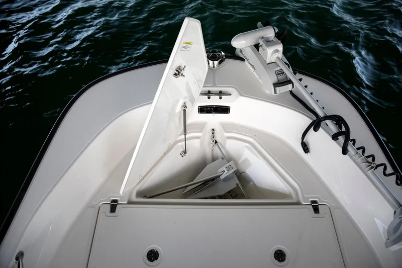 Slide: The Image of Manufacturer Provided Image: 2022 Boston Whaler 170 Montauk boat interior with steering wheel and seating. - 10