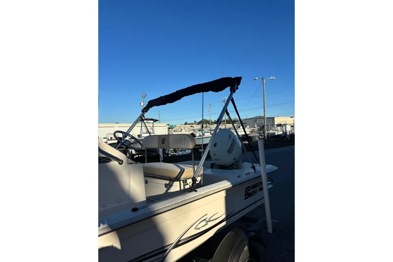Slide: The Image of 2018 Carolina Skiff 18 JVX CC boat with canopy and outboard motor. - 2