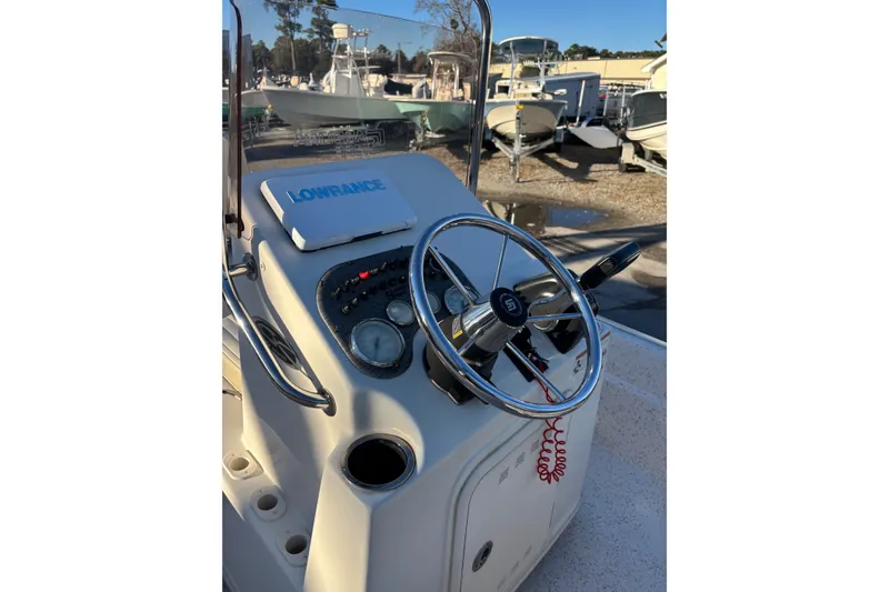 Slide: The Image of 2018 Carolina Skiff 18 JVX CC boat console with steering wheel and Lowrance device. - 4