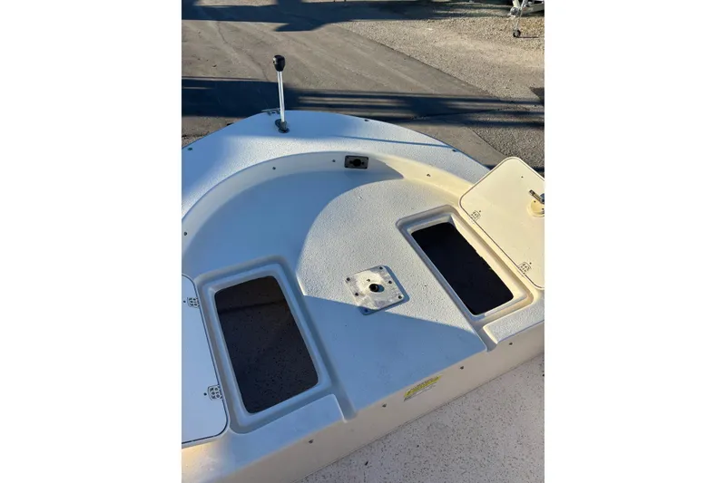Slide: The Image of 2018 Carolina Skiff 18 JVX CC boat deck with storage compartments. - 8