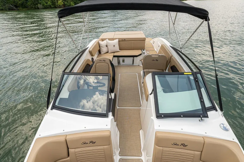 Slide: The Image of 2024 Sea Ray SPX 230 boat on calm water. - 10