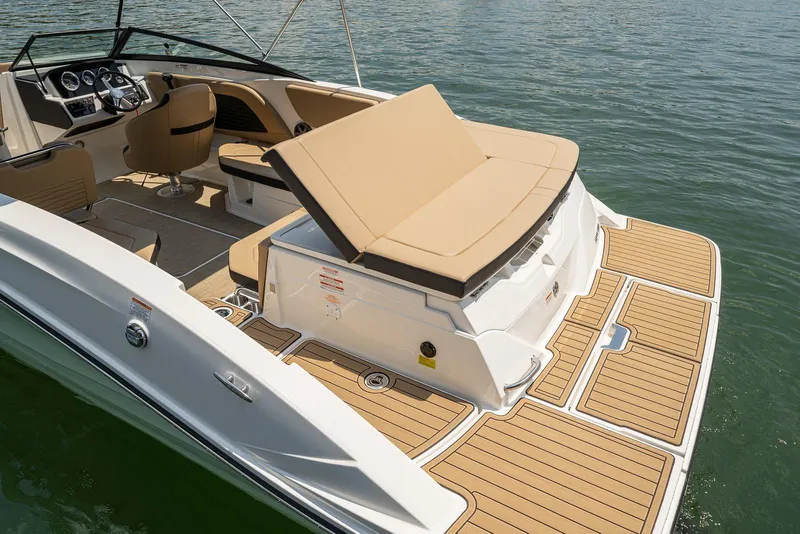Slide: The Image of 2024 Sea Ray SPX 230 boat with luxurious deck and seating. - 11