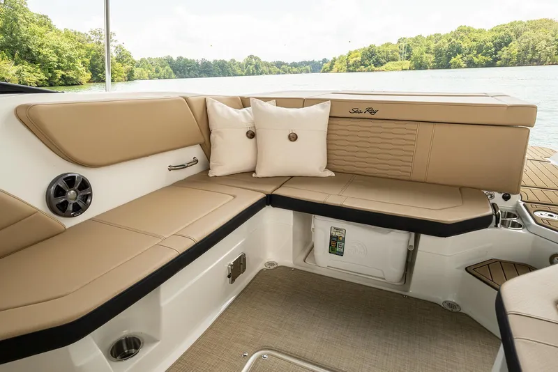 Slide: The Image of Interior of 2024 Sea Ray SPX 230 with beige upholstery and cushions. - 13