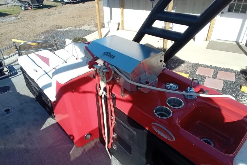 Slide: The Image of Red Razor 238 boat interior with seating and sink, 2019 model. - 16