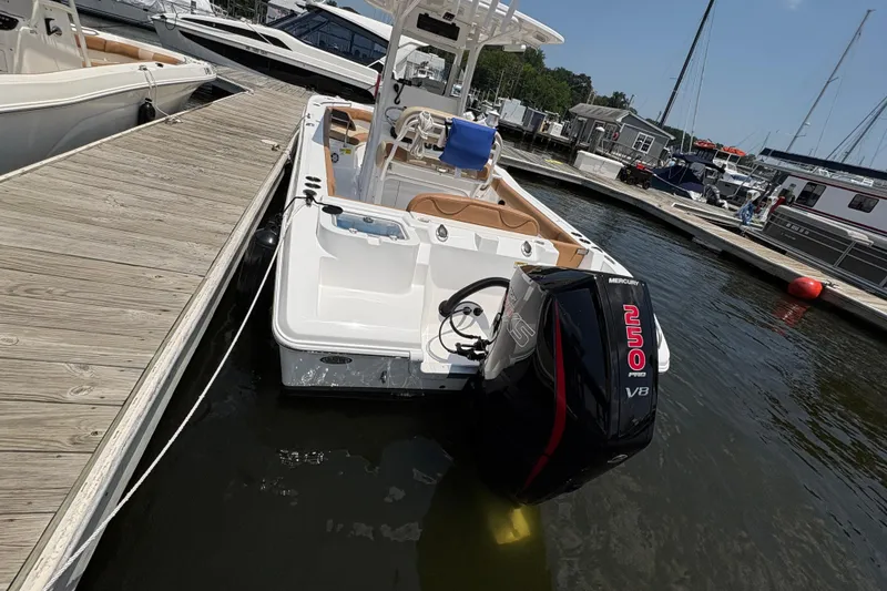Slide: The Image of 2025 NauticStar 242L Offshore boat docked with Mercury 250 V8 engine. - 6