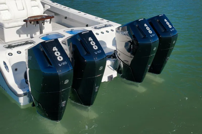 Slide: The Image of 2023 Freeman 43 boat with four Mercury 400 V10 outboard engines on water. - 11