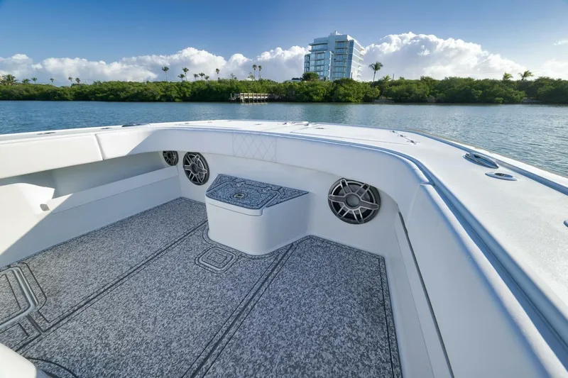 Slide: The Image of 2023 Freeman 43 boat interior with speakers, scenic waterfront view, and modern design. - 20