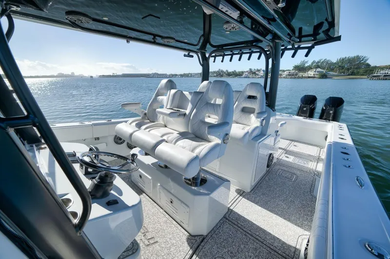 Slide: The Image of 2023 Freeman 43 boat interior with luxurious seating and scenic water view. - 27
