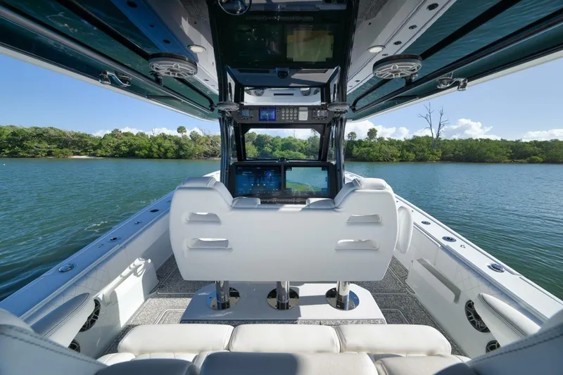 Slide: The Image of Interior view of 2023 Freeman 43 boat with advanced navigation system on a serene lake. - 32