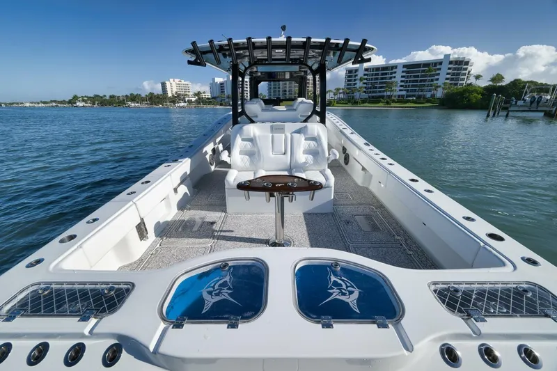 Slide: The Image of 2023 Freeman 43 boat on water, featuring spacious deck and modern seating. - 37