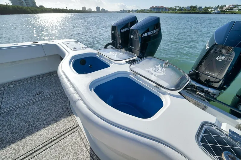 Slide: The Image of 2023 Freeman 43 boat with Mercury engines and livewell, on a sunny waterway. - 39