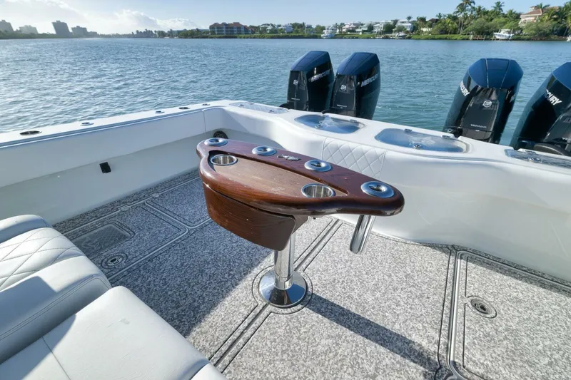 Slide: The Image of Luxury Freeman 43 boat interior with fishing rod holders, 2023 model, on a scenic waterway. - 41