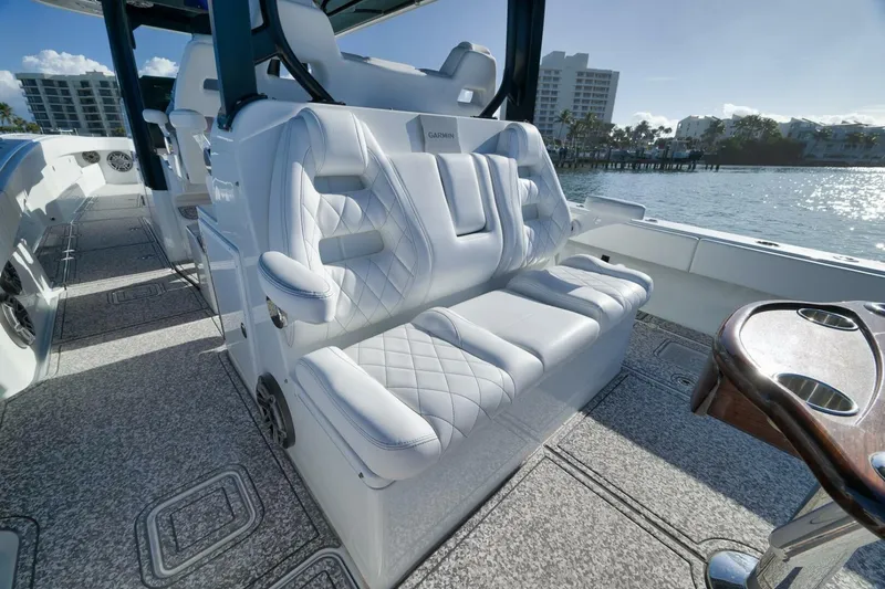Slide: The Image of Luxurious seating on 2023 Freeman 43 boat with waterfront view. - 42
