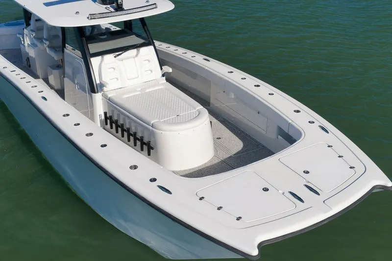 Slide: The Image of 2023 Freeman 43 boat on water, featuring spacious deck and modern design. - 5