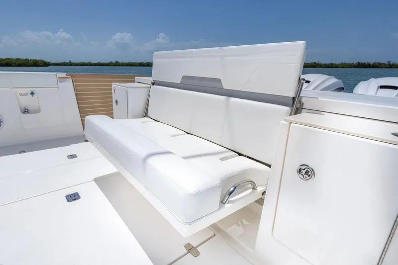 Slide: The Image of Manufacturer Provided Image: 2025 Pursuit OS 445 Offshore boat with white seating and sleek design. - 16