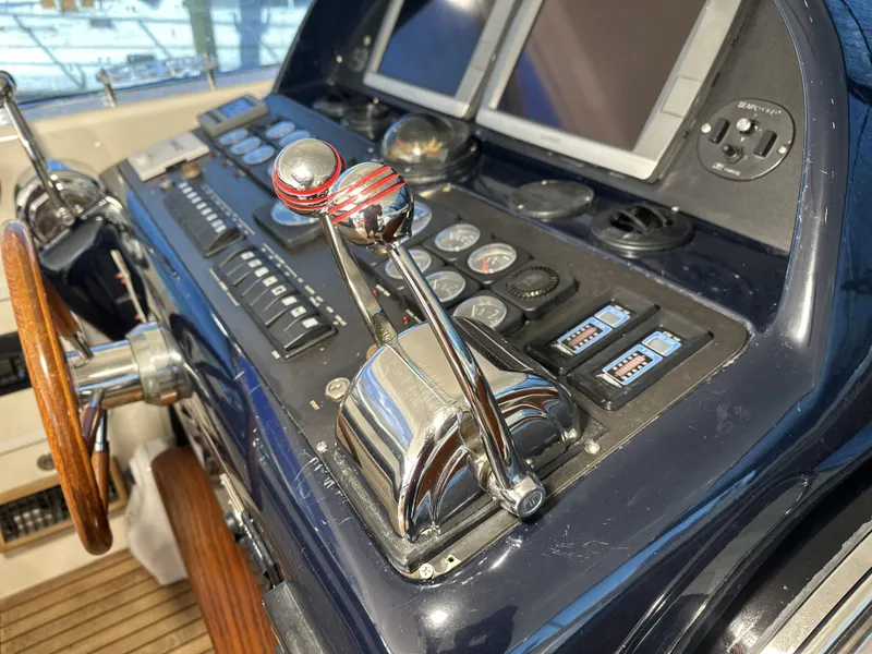 Slide: The Image of Control panel of a 1999 Uniesse 57 Open yacht with navigation instruments. - 33