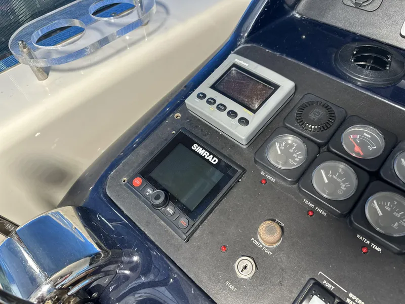 Slide: The Image of Control panel of 1999 Uniesse 57 Open yacht with Simrad navigation system. - 34