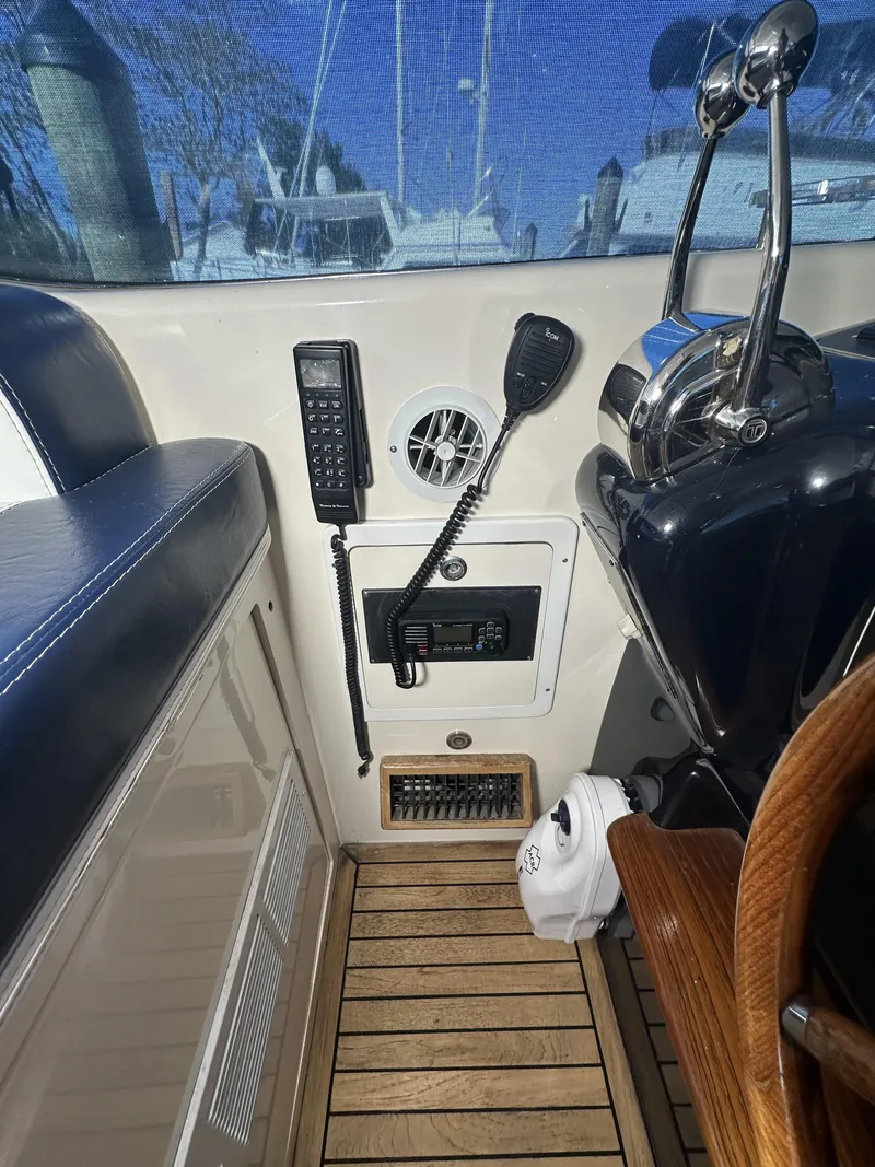 Slide: The Image of Interior view of 1999 Uniesse 57 Open yacht cockpit controls and communication equipment. - 41