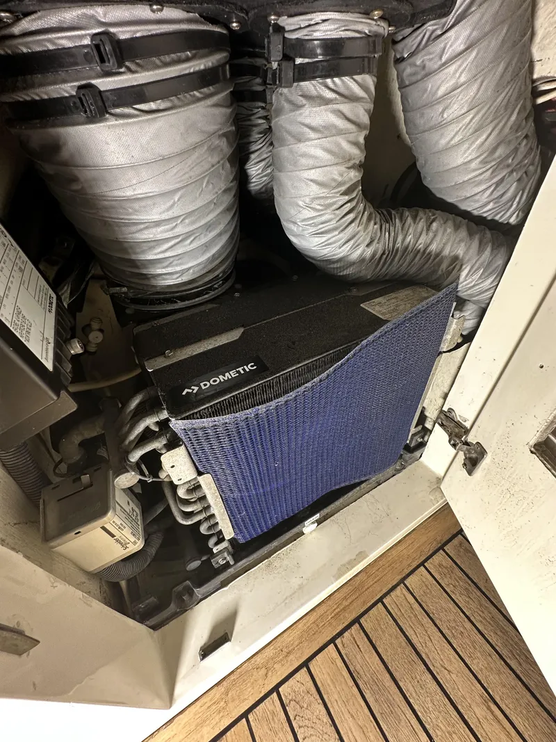 Slide: The Image of Engine room of 1999 Uniesse 57 Open yacht with Dometic equipment and ductwork. - 42