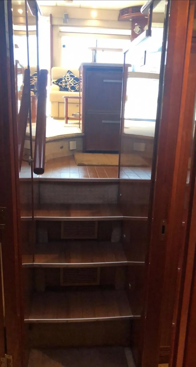 Slide: The Image of Interior view of 2009 Riviera 47 Enclosed Flybridge Series II yacht staircase. - 23