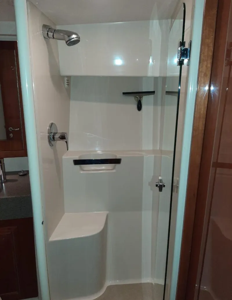 Slide: The Image of Shower area in 2009 Riviera 47 Enclosed Flybridge Series II yacht, featuring modern fixtures. - 24