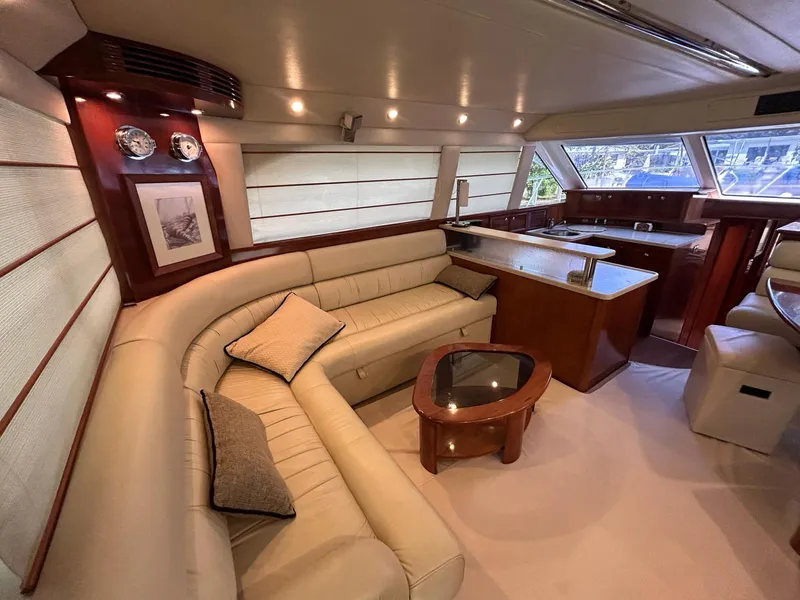 Slide: The Image of Interior of 2009 Riviera 47 Enclosed Flybridge with elegant leather seating. - 4
