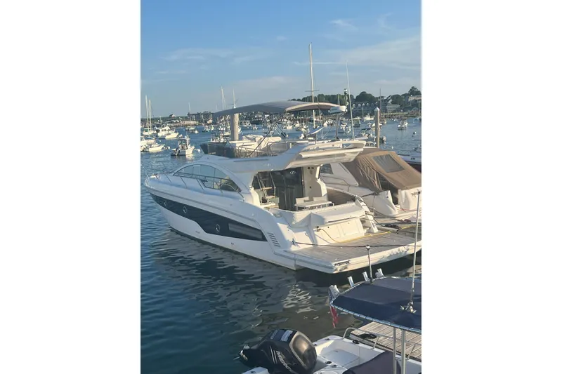 Slide: The Image of Luxury 2019 Schaefer 510 GT Pininfarina yacht docked in a marina under clear skies. - 26