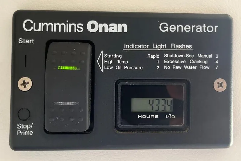 Slide: The Image of Cummins Onan generator control panel. - 53