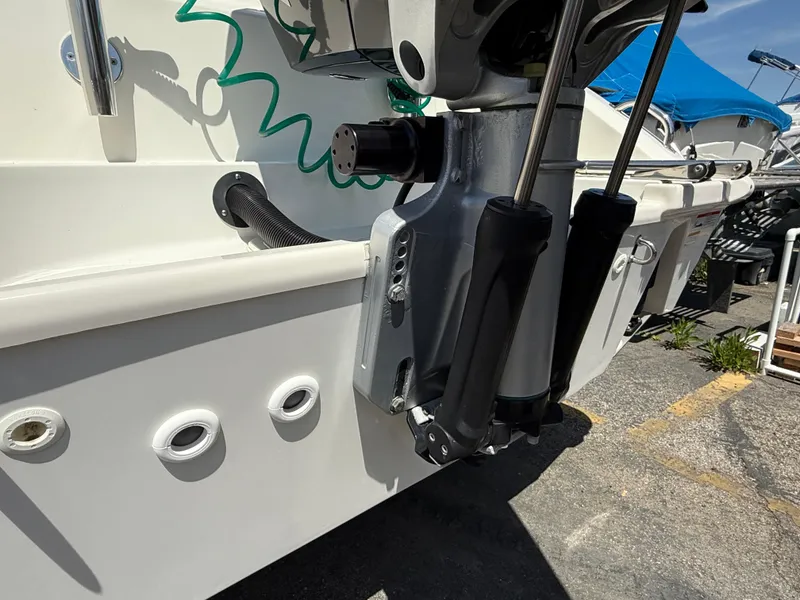 Slide: The Image of 2019 Boston Whaler 230 Outrage boat engine mount detail in marina setting. - 12