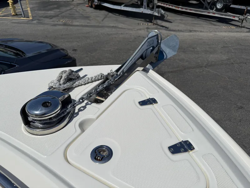 Slide: The Image of 2019 Boston Whaler 230 Outrage boat anchor and winch system on deck. - 29
