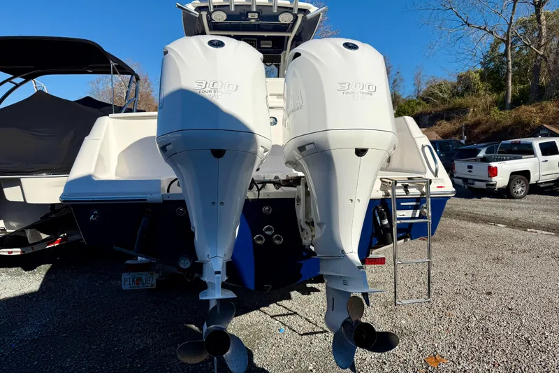 Slide: The Image of 2014 Everglades 295 Center Console with twin 300 horsepower outboard engines. - 5
