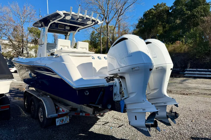 Slide: The Image of 2014 Everglades 295 Center Console boat with dual Yamaha outboard engines on a trailer. - 6